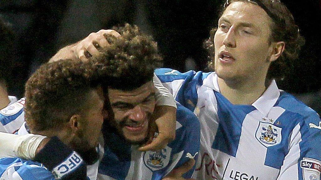 Huddersfield players celebrate Billing's winner