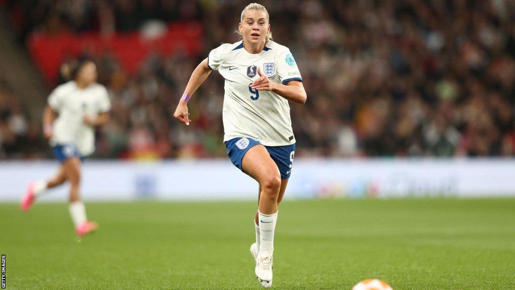 Alessia Russo chases after a ball while playing for England