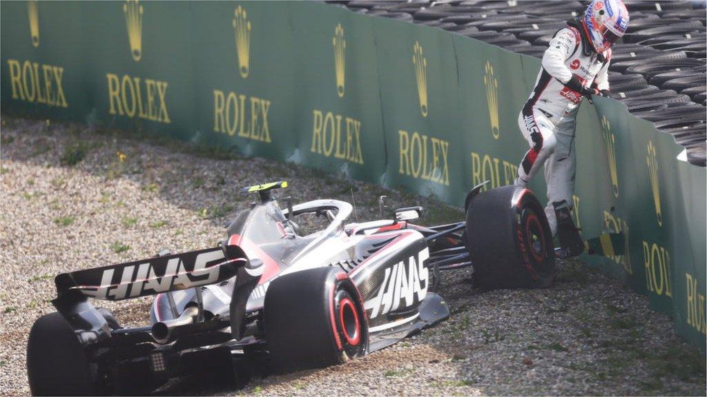 Nico Hulkenberg climbs out of the Haas