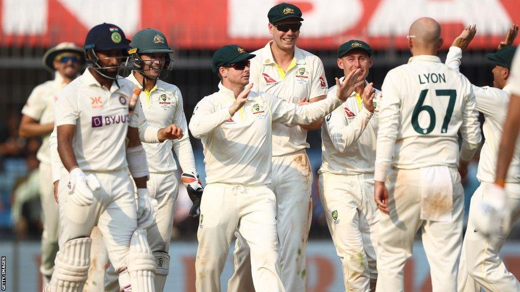 Steve Smith of Australia celebrates taking a catch to dismiss Cheteshwar Pujara of India