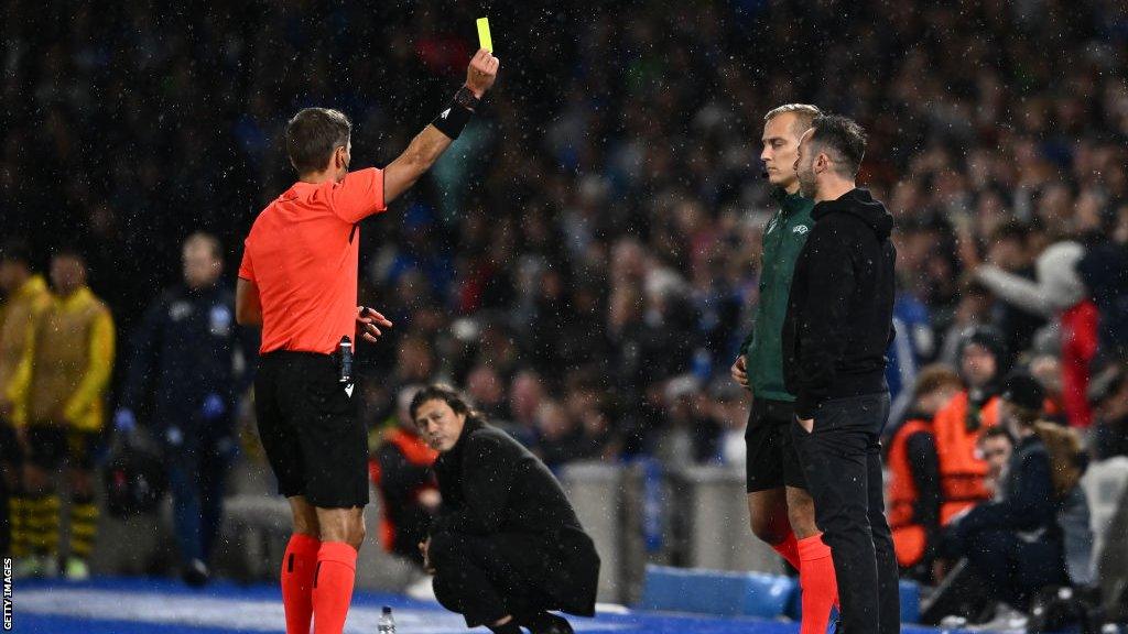 Roberto De Zerbi is shown a yellow card in his side's match with AEK Athens