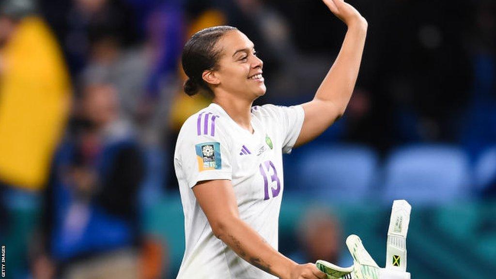 Becky Spencer salutes fans after the game