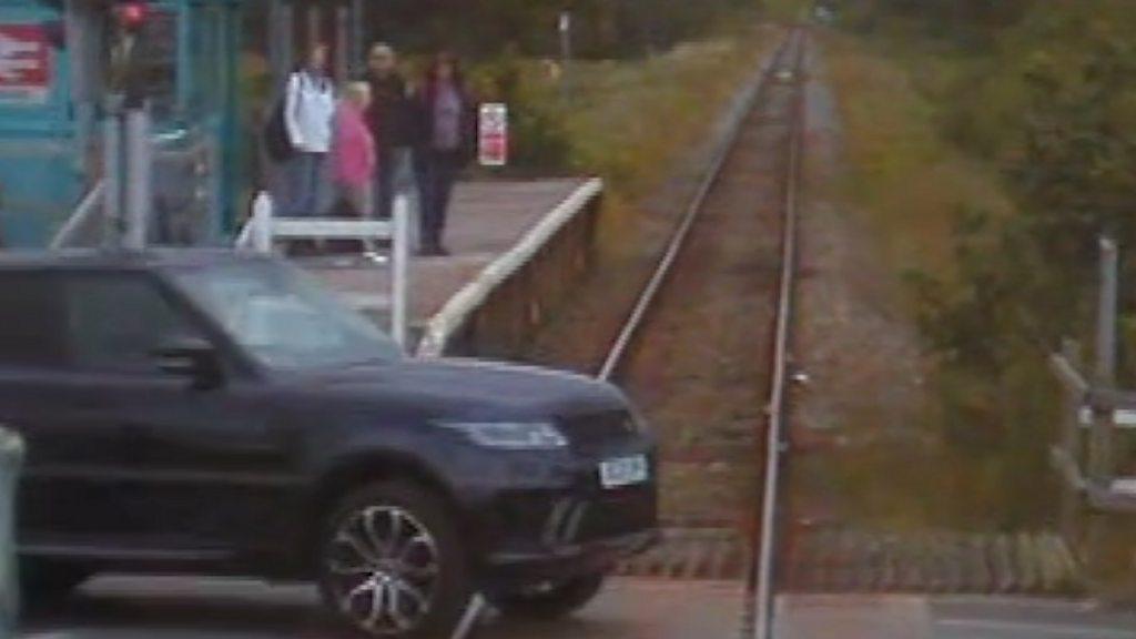 Car crosses train line