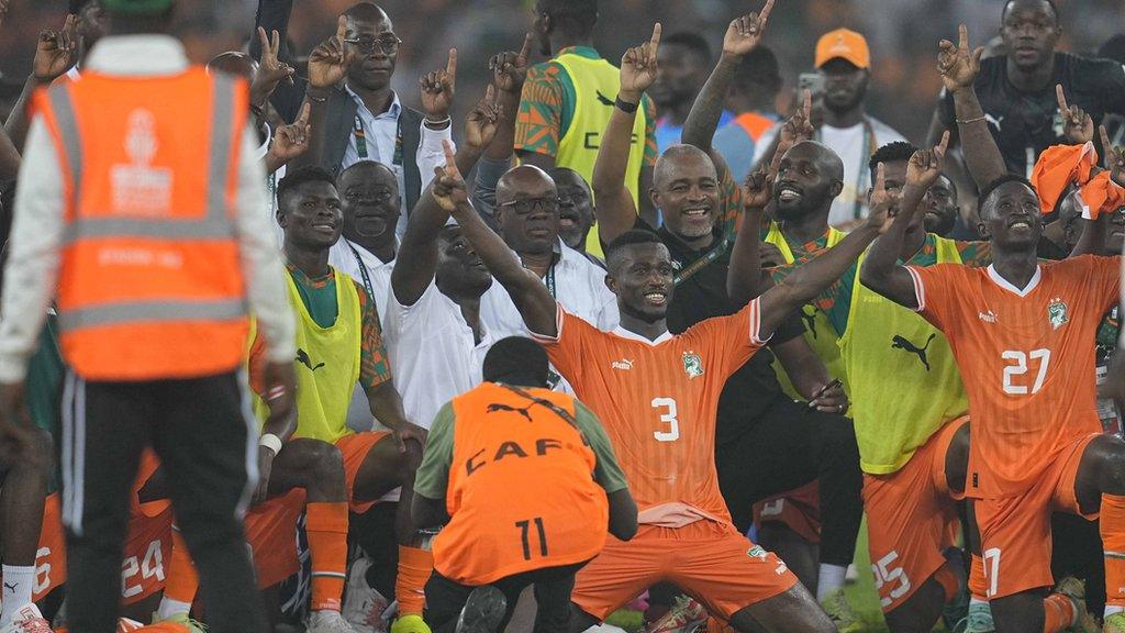 Ivory Coast players celebrate beating DR Congo