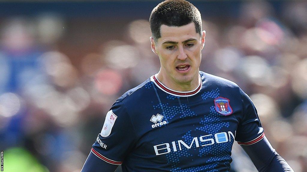 Jon Mellish in action for Carlisle