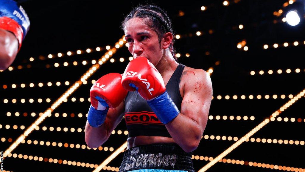 Amanda Serrano with her gloves up in the ring