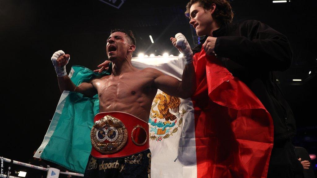 Luis Alberto Lopez celebrates beating Josh Warrington