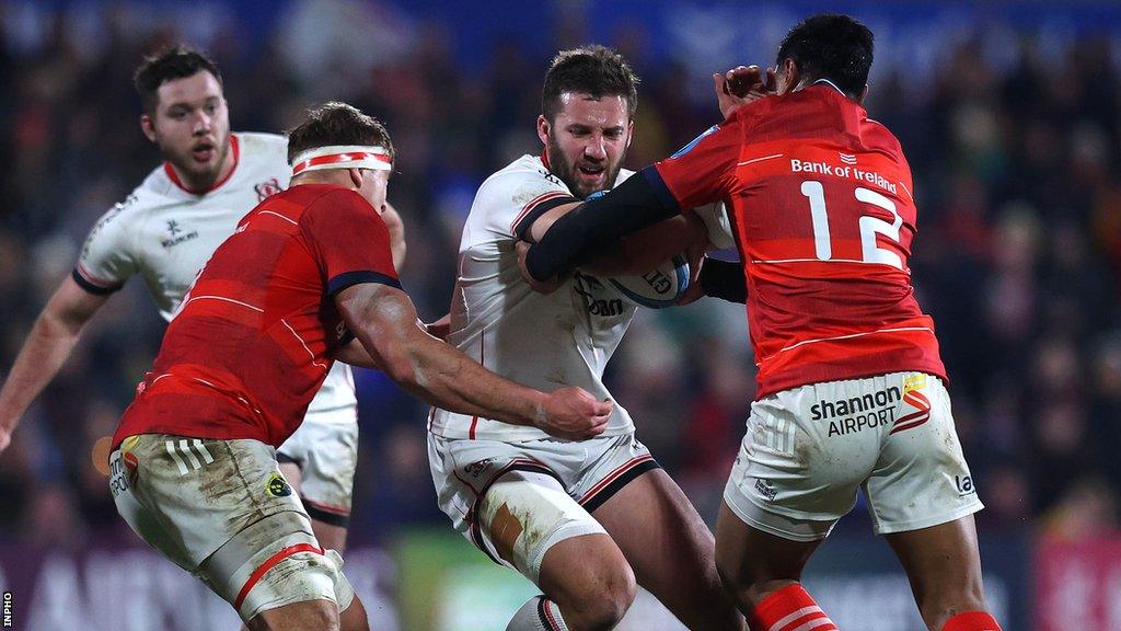 Stuart McCloskey is tackled by Munster pair Gavin Coombes and Malakai Feitoa in Sunday's derby