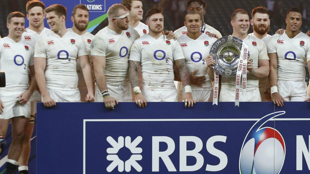 Dylan Hartley holds the Triple Crown trophy