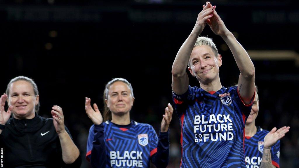 Megan Rapinoe salutes the crowd