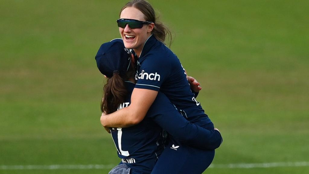 England players Tammy Beaumont and Emma Lamb embrace