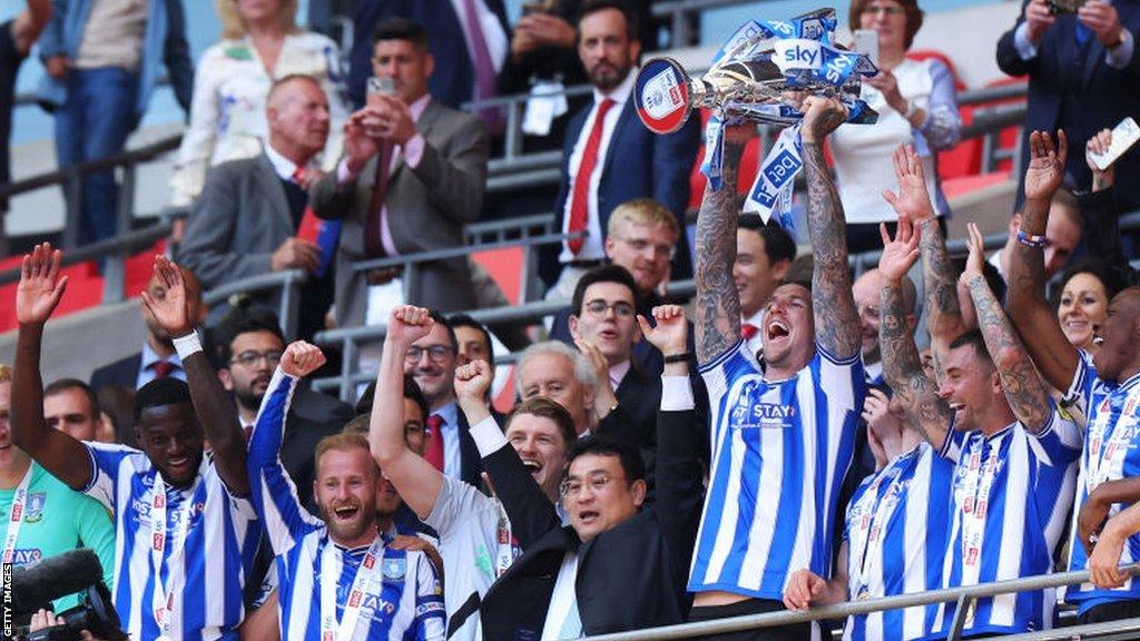 Sheffield Wednesday owner Dejphon Chansiri celebrating with the players at Wembley in the League One play-off final in May