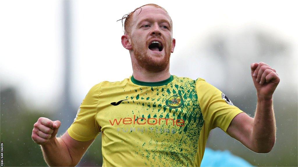 Sion Bradley celebrates after scoring one of his three goals for Caernarfon