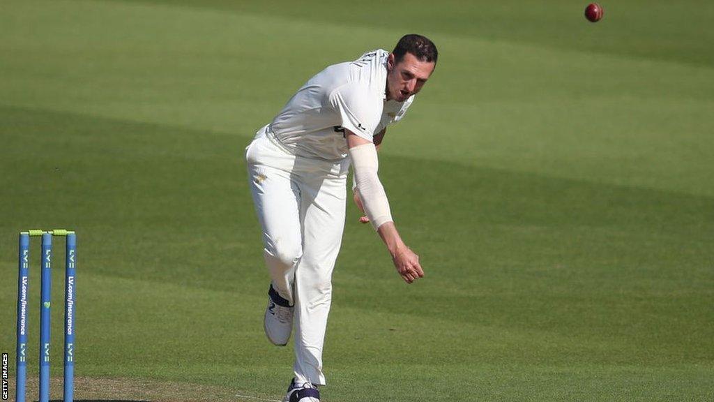 Surrey paceman Dan Worrall delivers the ball, on his way to taking two of the three Warwickshire wickets to fall on Tuesday