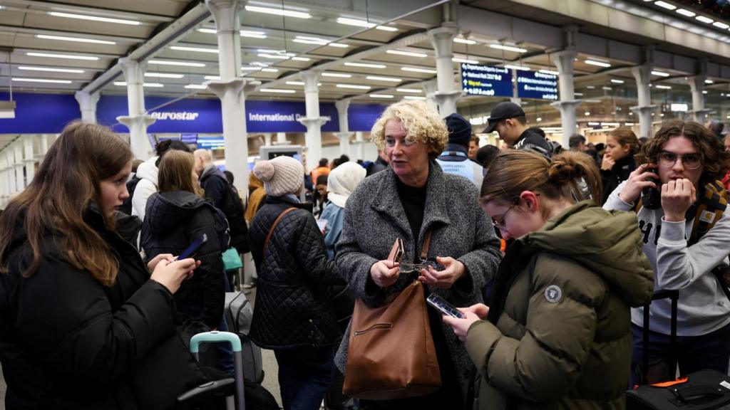 Passengers wait at the Eurostar terminal in St Pancras International Station, as an unexpected strike by French workers at Eurotunnel, the undersea link between Britain and continental Europe