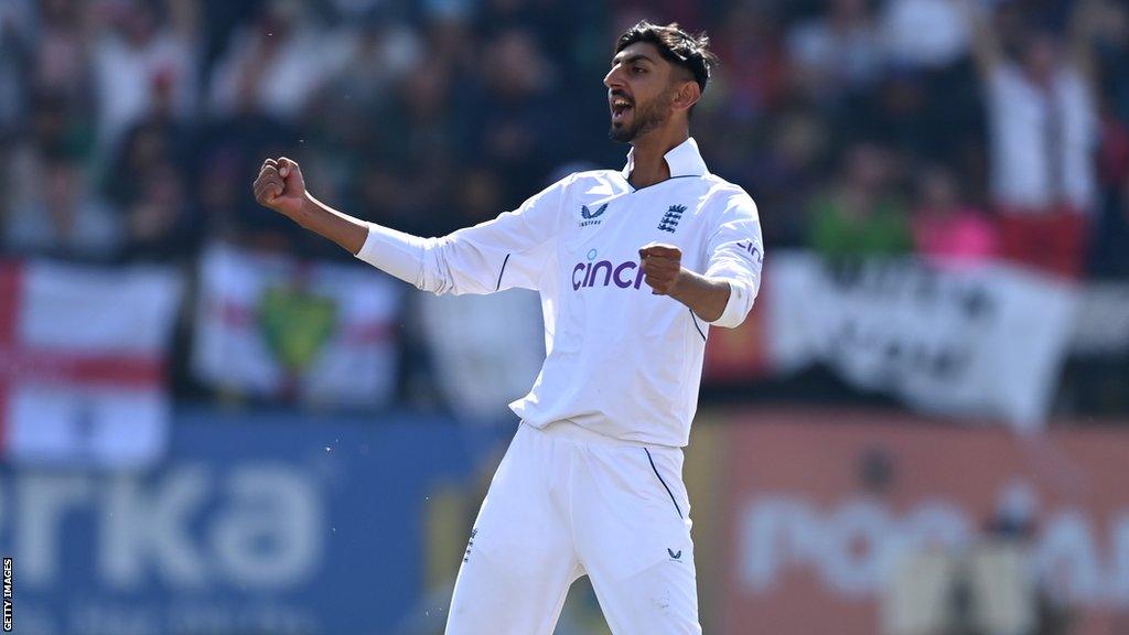 Shoaib Bashir celebrates taking a wicket for England