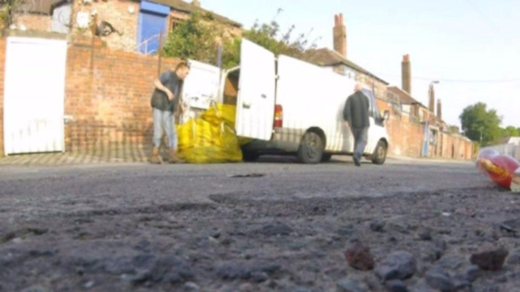 Men fly-tipping large bags