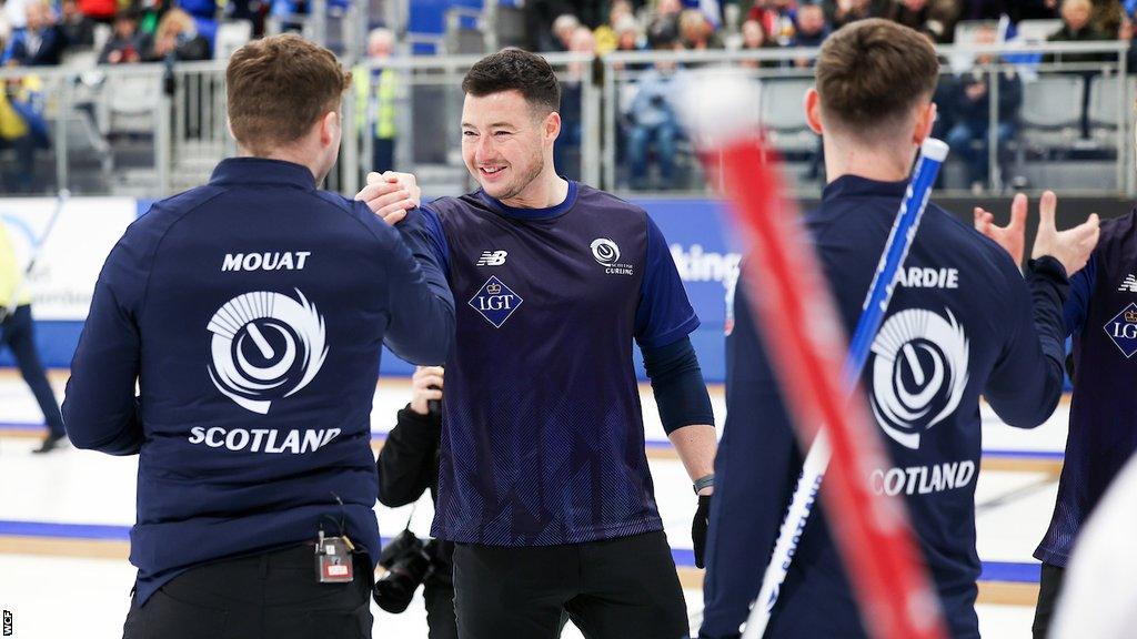 Bruce Mouat's rink celebrate after beating Switzerland