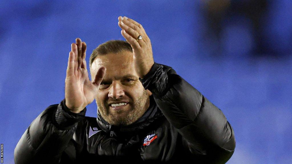 Ian Evatt applauds the Bolton fans