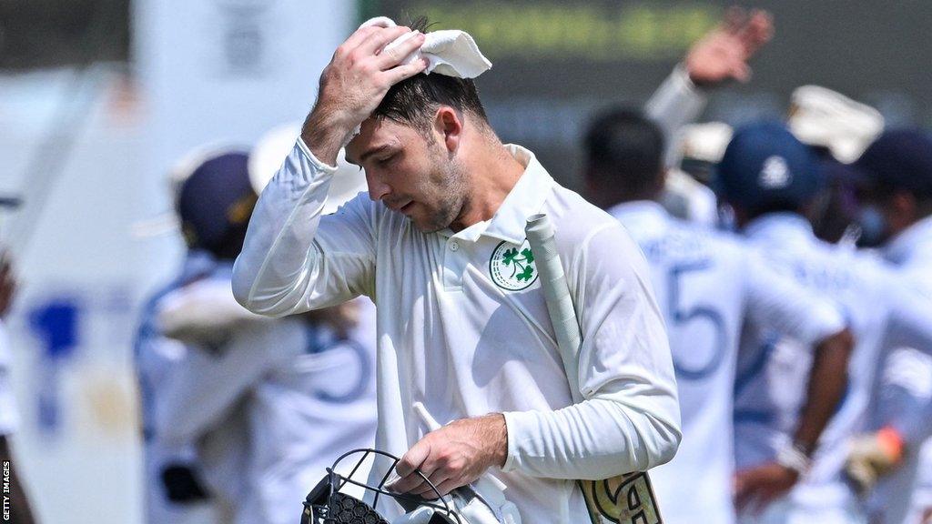 Ireland's Curtis Campher leaves the field in Galle after his dismissal