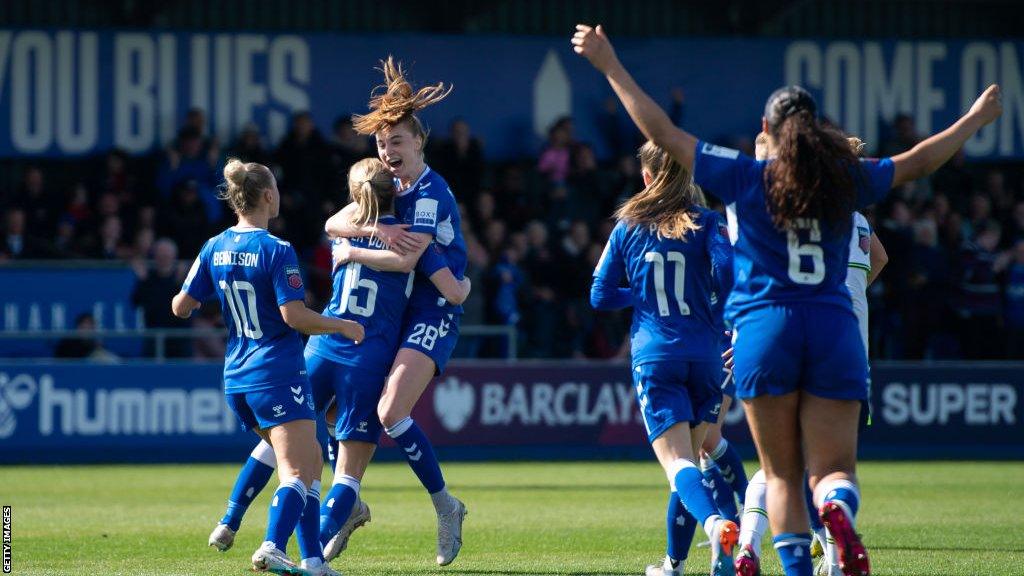 Aggie Beever-Jones celebrates with her team-mates after scoring a late winner for Everton against Spurs