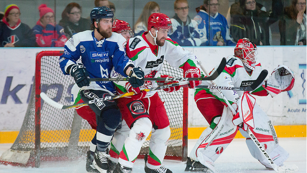 Devils Defenceman Tyson Strachan battles with a Lightning forward in front of the net