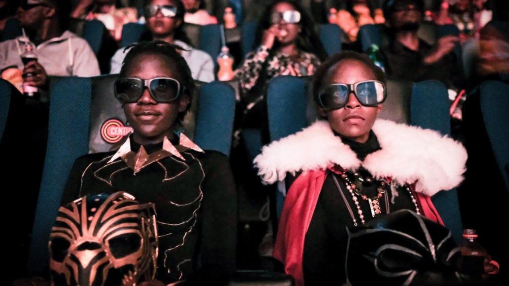 Cosplayers watches the film 'Black Panther' in 3D which featuring Oscar-winning Mexico born Kenyan actress Lupita Nyongo during Movie Jabbers Black Panther Cosplay Screening in Nairobi, Kenya, on February 14, 2018