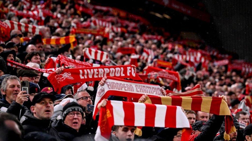 Liverpool fans display their scarves at Anfield