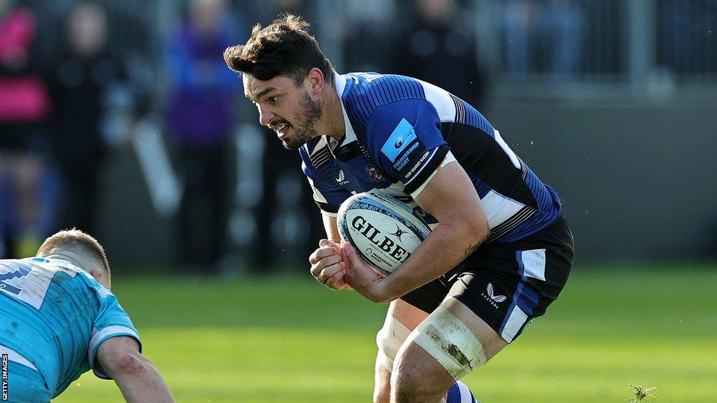 Jaco Coetzee braces himself for a tackle while holding the ball during Bath's win against Sale