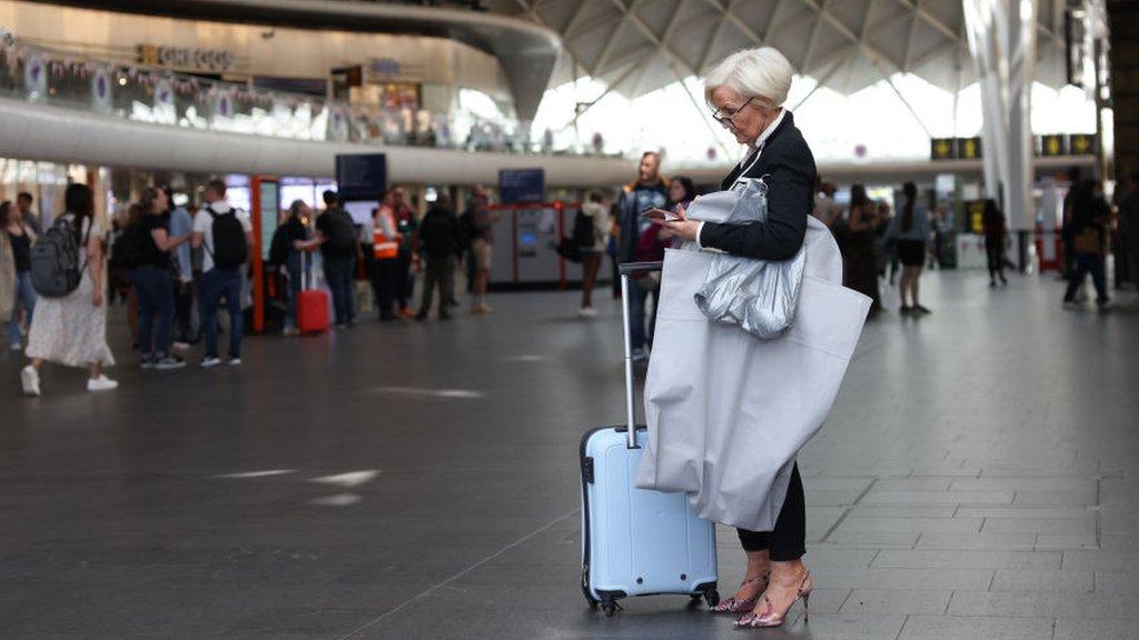 A traveller at Kings Cross station on June 25, 2022