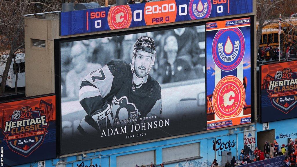 A general view of a video tribute to Adam Johnson shown before the NHL Heritage Classic game between the Calgary Flames and the Edmonton Oilers in Alberta on Sunday