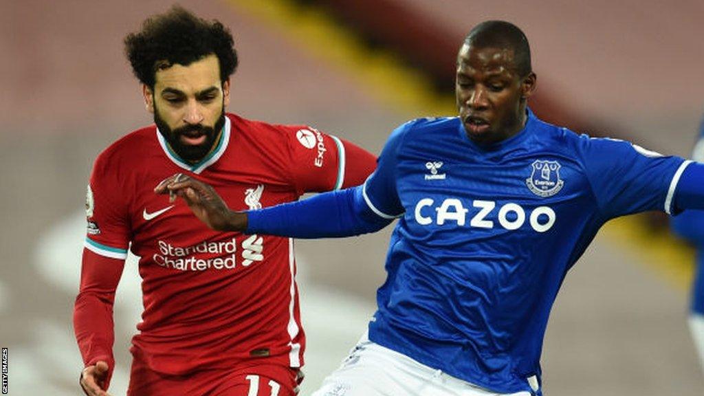 Abdoulaye Doucoure (right) and Mohamed Salah (left)