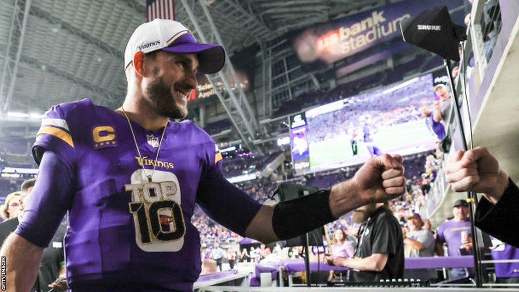 Kirk Cousins wearing a Top 10 chain after a Minnesota Vikings game