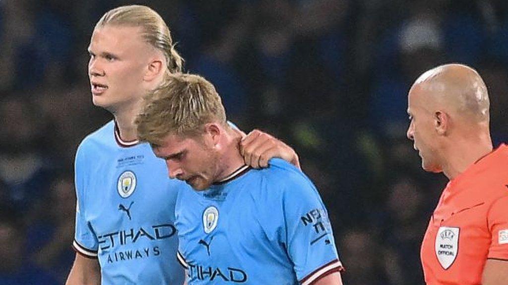 Kevin de Bruyne is consoled by team-mate Erling Haaland as he is substituted after getting injured in the 2023 Champions League final