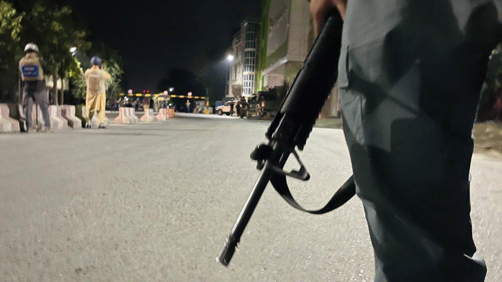 A soldier stands guard in Kabul after an attack on the defence minister's house