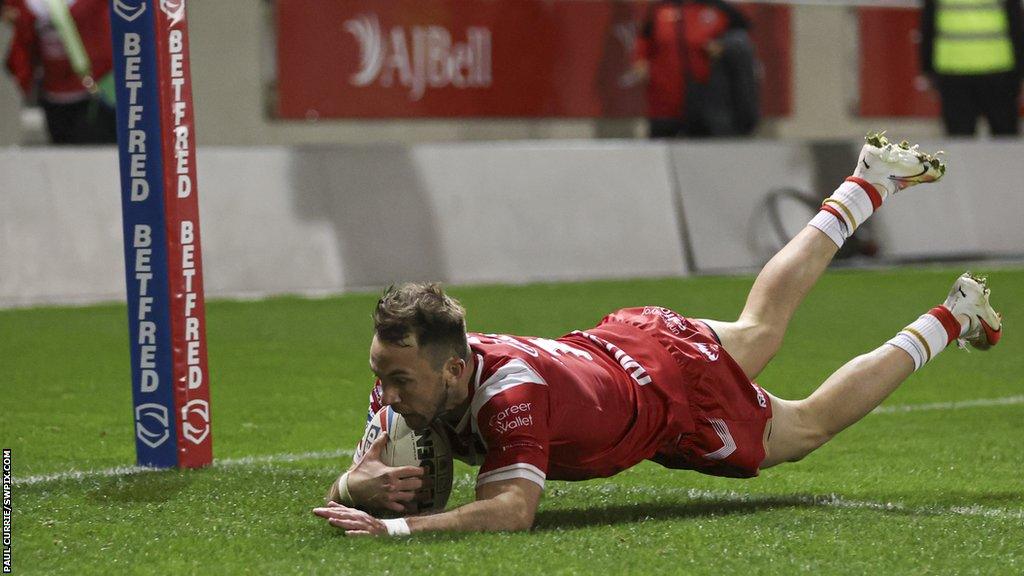 Ryan Brierley of Salford Red Devils scores a try against Wakefield Trinity