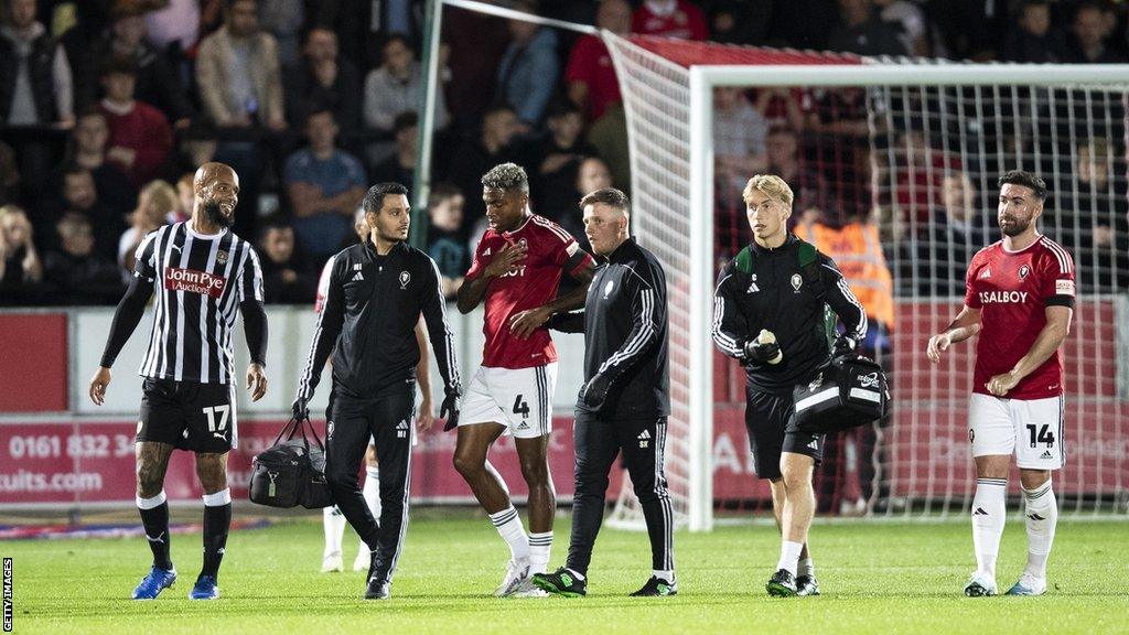 Salford midfielder Ossama Ashley is substituted against Notts County