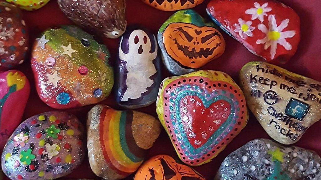 Communities across the UK are coming together to decorate and hide stones in public places.