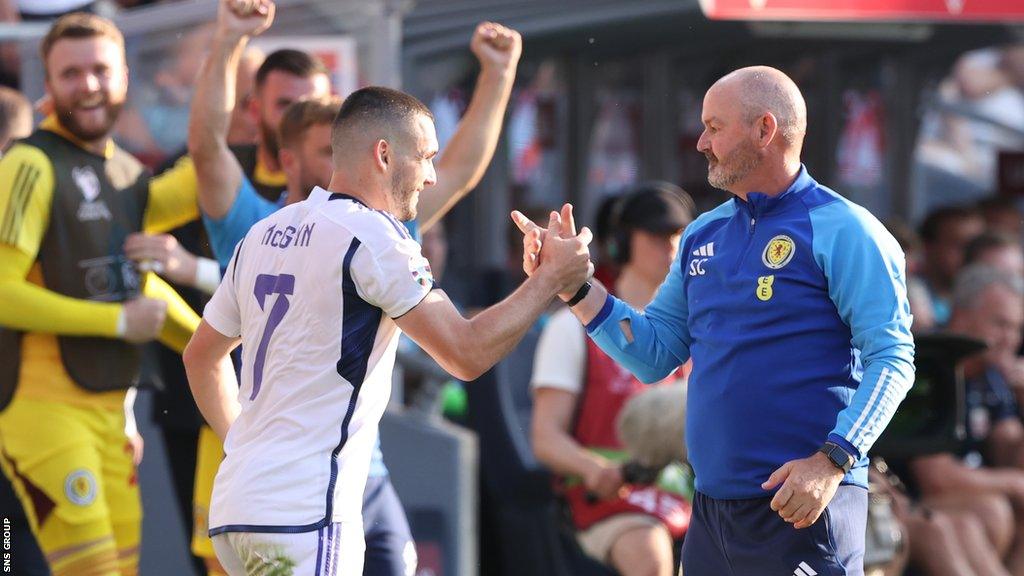 Steve Clarke and John McGinn celebrate a dramatic win over Norway in Oslo