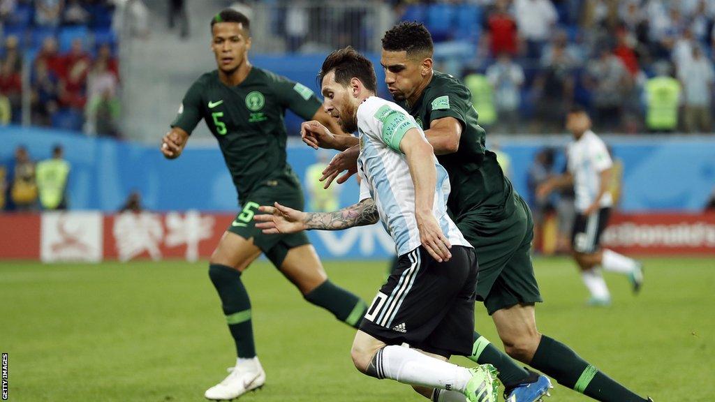 William Troost-Ekong (left) and Lionel Messi (centre)