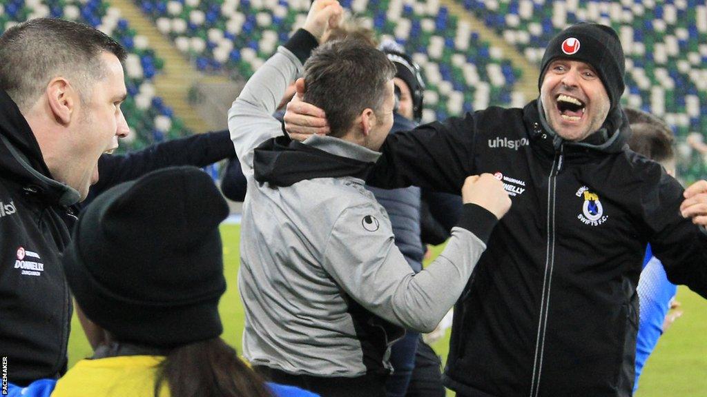 Rodney McAree celebrates with Swifts fans after winning the League Cup in 2018