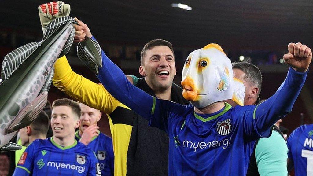 Grimsby Town's Anthony Glennon celebrates in a fish mask after beating Southampton in the FA Cup