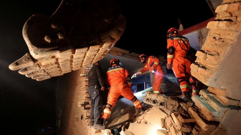 Rescue workers conduct search and rescue operations at Kangdiao village following the earthquake in Jishishan county, Gansu province