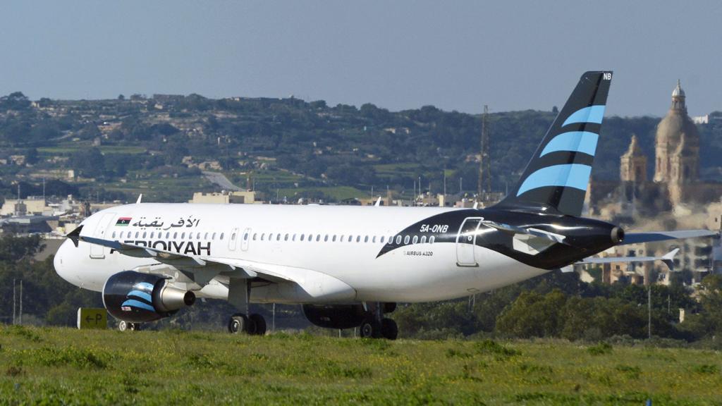 A hijacked Airbus A320 operated by Afriqiyah Airways after it landed at Luqa Airport, in Malta - 23 December 2016