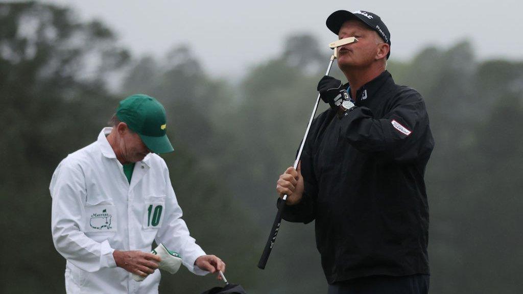 Sandy Lyle kisses his replica putter from his 1988 Masters win