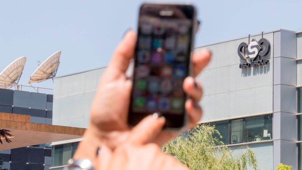 Mobile phone in front of NSO building (file photo)