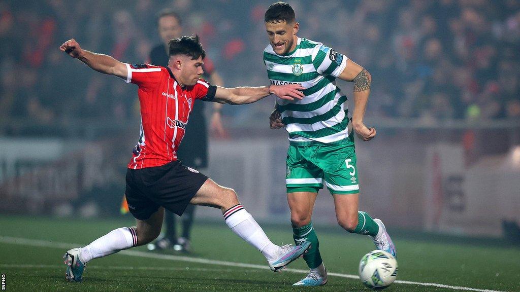 Candystripes midfielder Adam Reilly closes down Lee Grace at the Brandywell