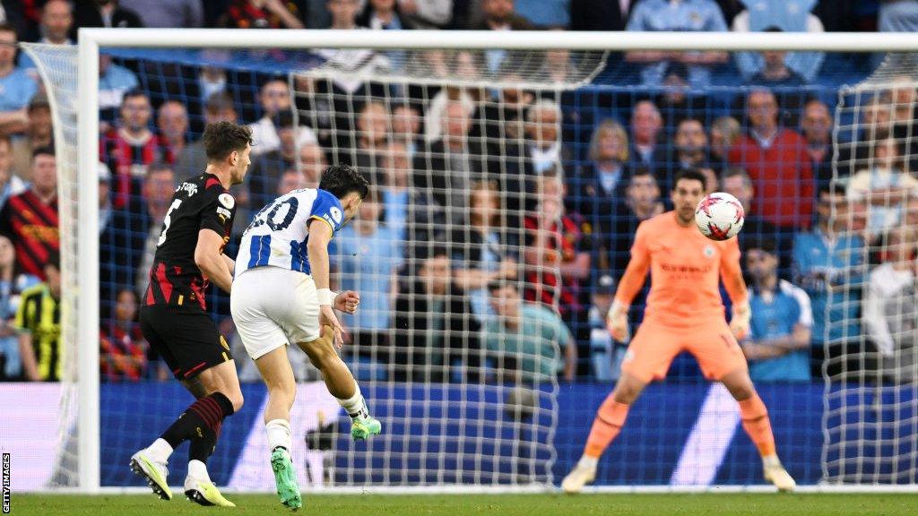 Brighton's Julio Enciso scores against Manchester City