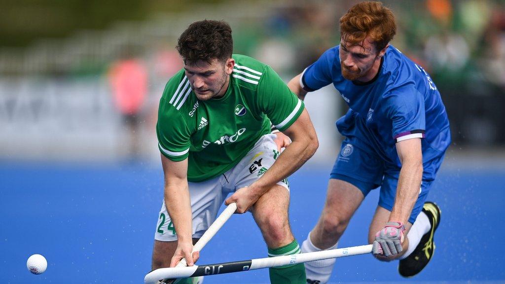 Ireland's Ben Walker is tackled by Scottish opponent Joe McConnell in Dublin