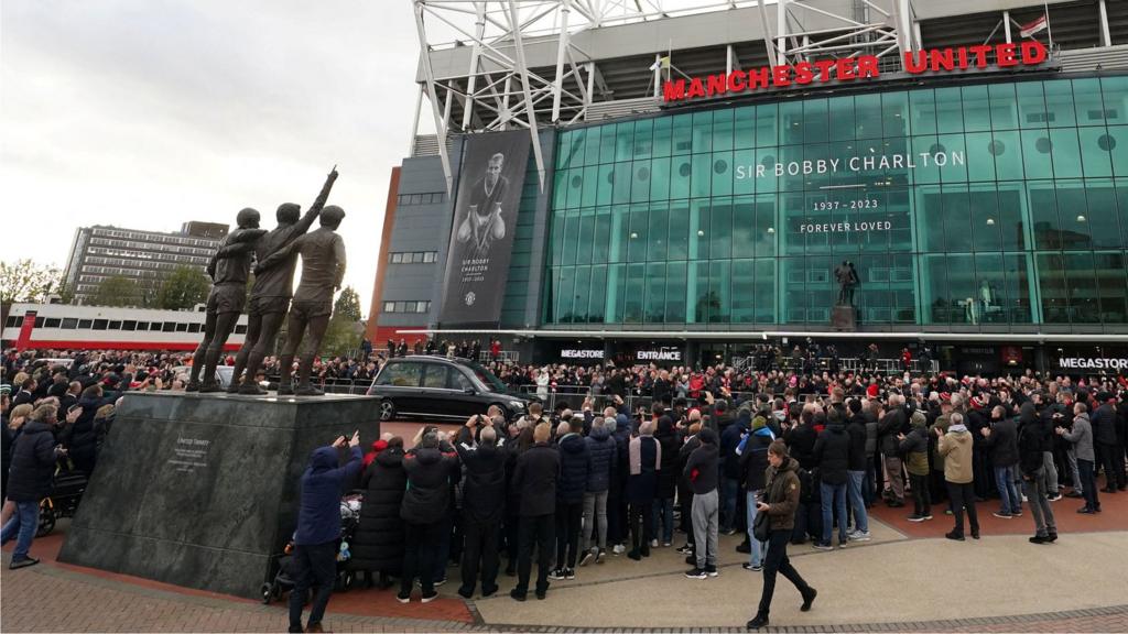 Fans at Old Trafford paying tribute to Sir Bobby Charlton